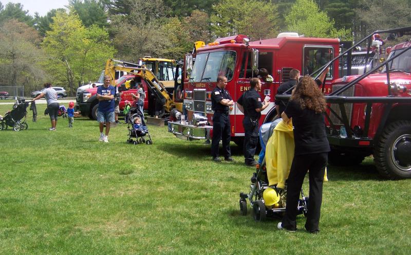 Families stroll around the touch a truck event hosted by the Marion Recreation Department. BY MATTHEW BERNAT